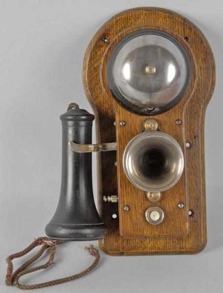 Appraisal: Oak Ericsson Wall Telephone Description Circa Phone has a single