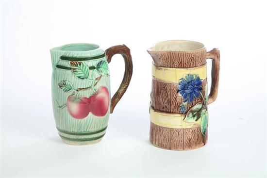 Appraisal: TWO MAJOLICA PITCHERS Unattributed Both barrel form with branch handles