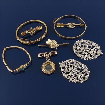 Appraisal: A gold compass pendant Three assorted bar brooches A bracelet