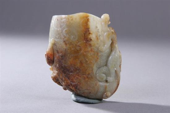 Appraisal: CHINESE CELADON JADE LIBATION CUP Ming dynasty Carved to depict