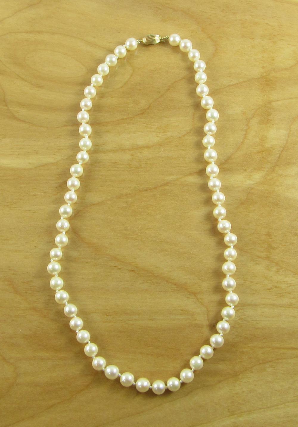 Appraisal: AKOYA PEARL AND FOURTEEN KARAT GOLD NECKLACE The hand knotted