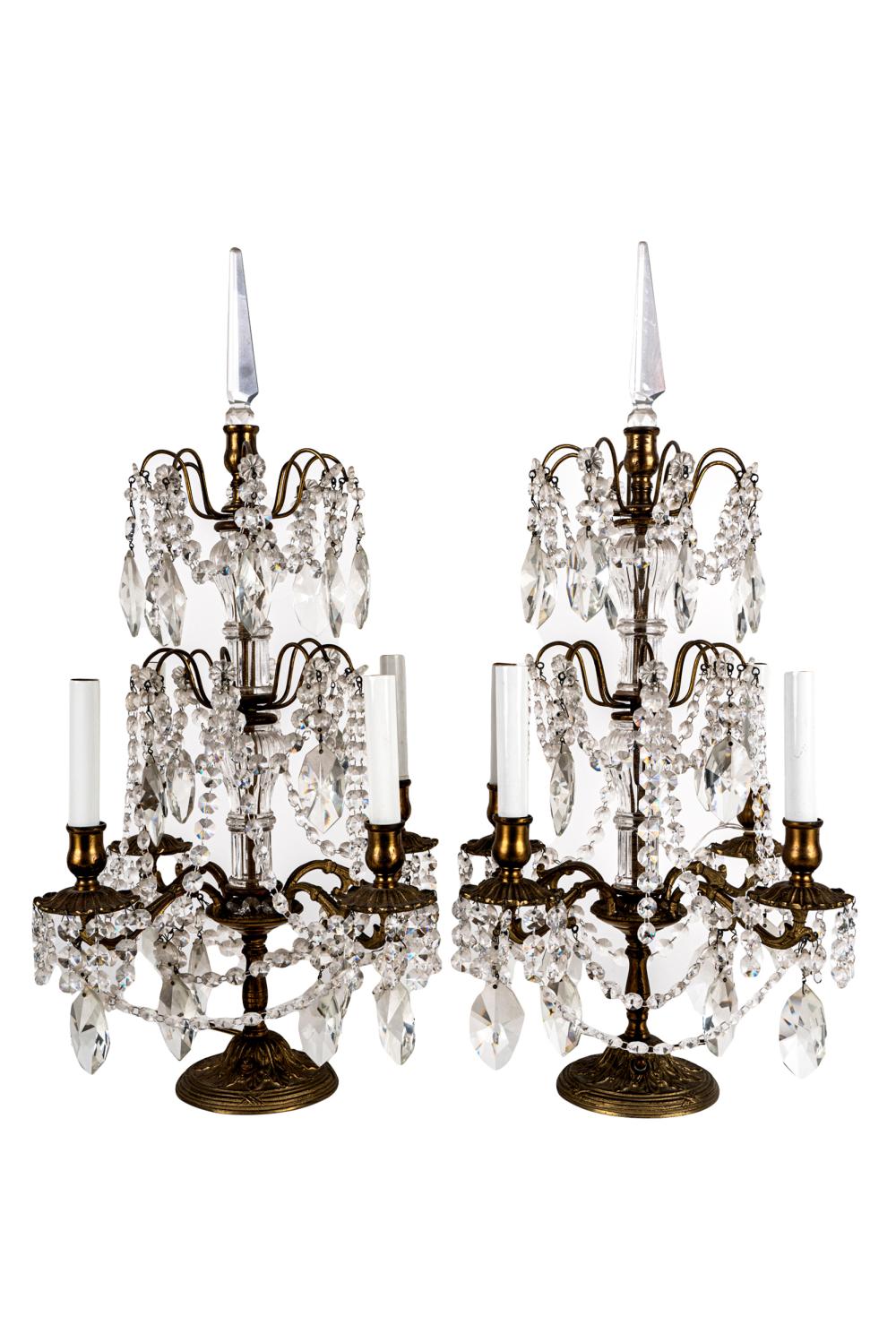 Appraisal: PAIR OF CRYSTAL GILT METAL GIRANDOLESeach with four lights Condition