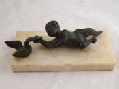 Appraisal: A bronze figure of a baby and a swan l