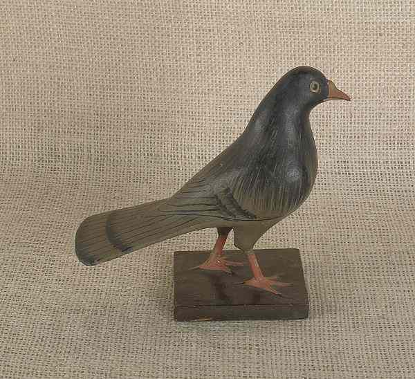 Appraisal: Carved and painted figure of a pigeon ca h