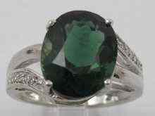 Appraisal: A white metal tests ct gold diamond and tourmaline ring