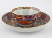 Appraisal: A th c Chinese ceramic tea bowl and saucer decorated