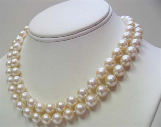 Appraisal: A Pearl Diamond and Gold Necklace an opera length strand