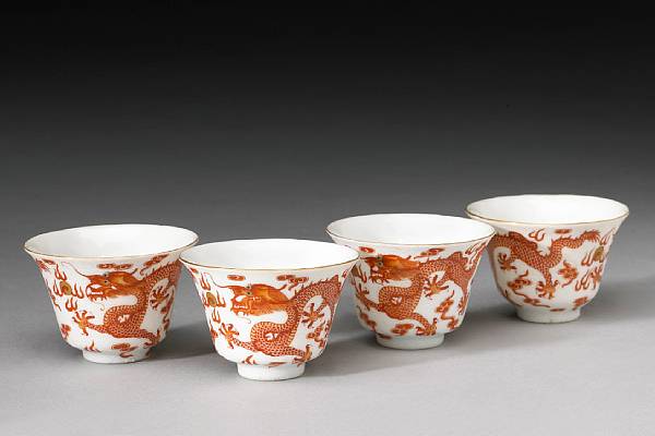 Appraisal: Four coral red and sgraffiato-white enameled porcelain wine cups Xianfeng