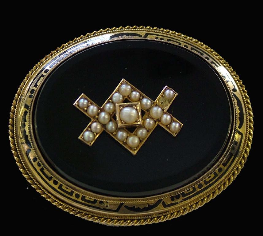 Appraisal: Victorian oval gold and enamel brooch with locket reverse set