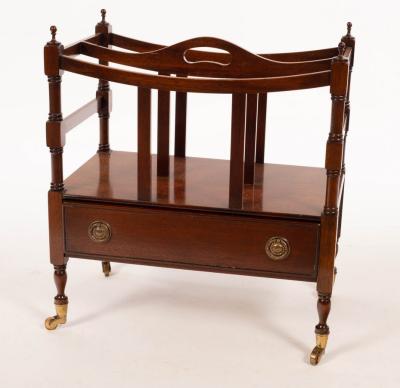 Appraisal: A mahogany two division Canterbury with drawer under on turned