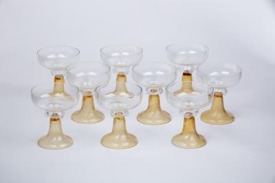 Appraisal: A set of nine champagne coupes with clear glass bowls