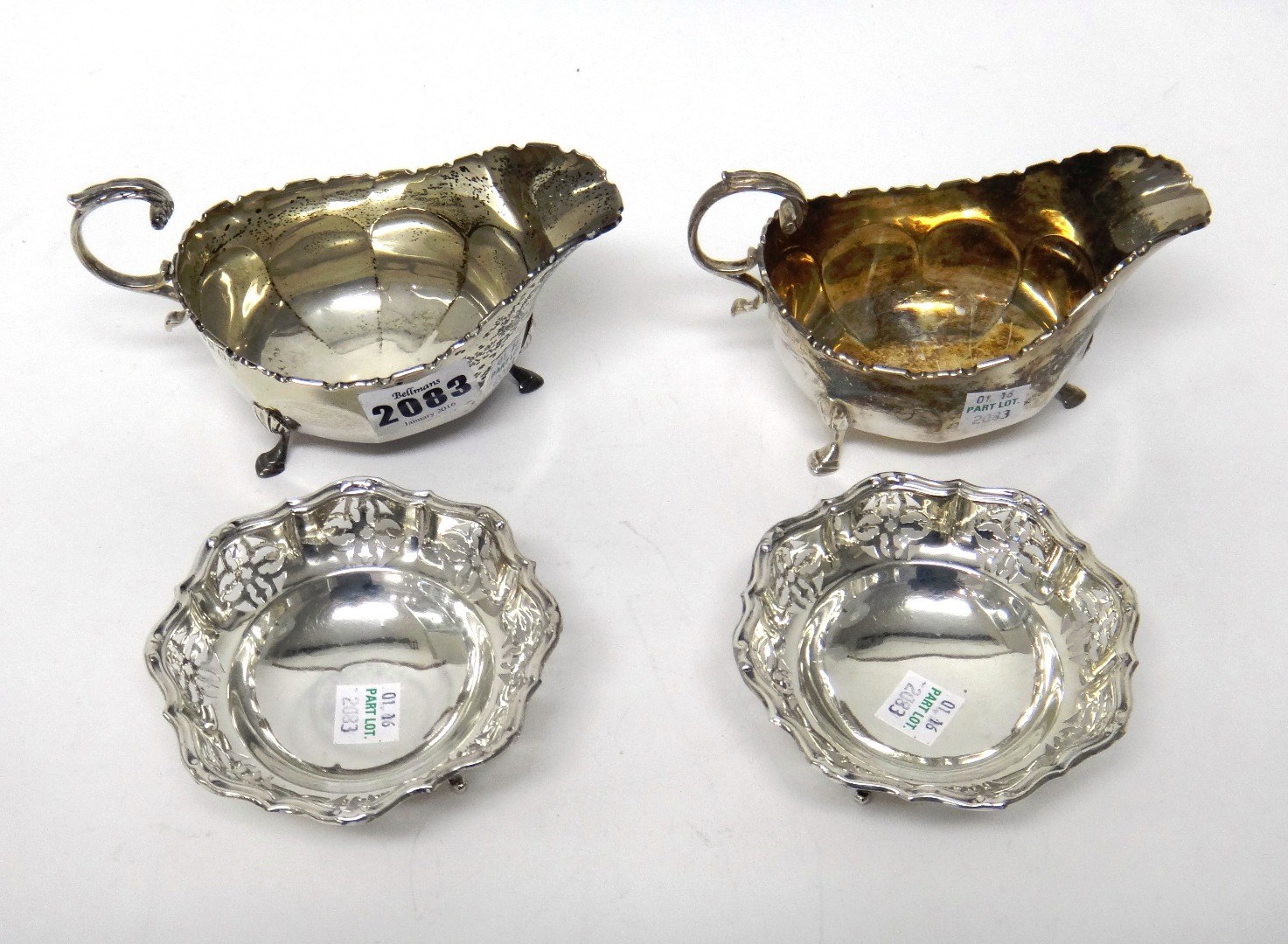 Appraisal: A pair of Scottish silver sauceboats each of faceted form