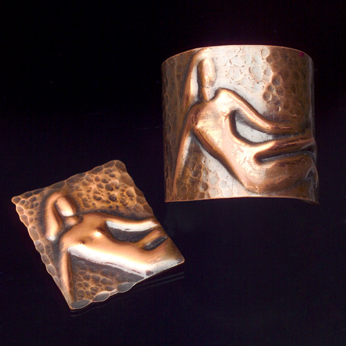 Appraisal: REBAJES Reclining nude cuff in raised and hammered copper with