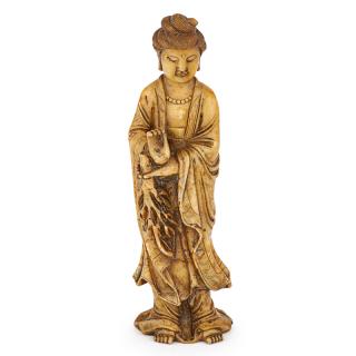 Appraisal: CHINESE SOAPSTONE SCULPTURE OF GUANYIN Right hand in a teaching