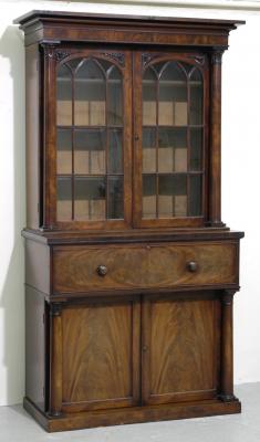 Appraisal: A MAHOGANY SECRETAIRE BOOKCASE the moulded cornice and protruding frieze