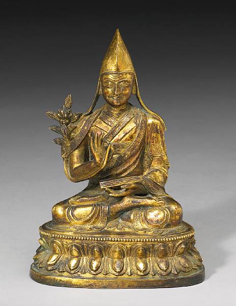 Appraisal: A Tibetan gilt bronze figure of a seated lama th