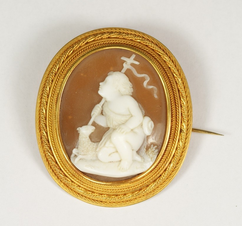 Appraisal: Unmarked YG oval carved shell cameo cherub with lamb frame