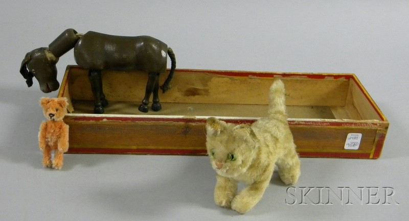 Appraisal: Three Small Toy Animals a small cinnamon Schuco articulated bear