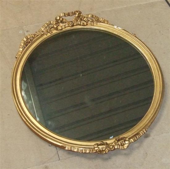 Appraisal: th century gilt gesso framed round wall mirror with ribbon