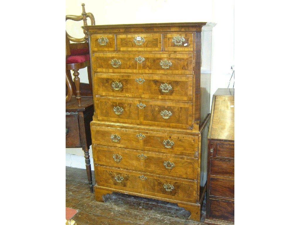 Appraisal: An th century walnut and figured walnut veneered chest on