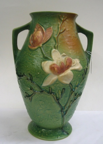 Appraisal: ROSEVILLE POTTERY HANDLED VASE in the magnolia pattern white flowers