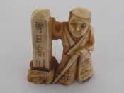 Appraisal: An early th century Japanese carved ivory katabori netsuke modelled