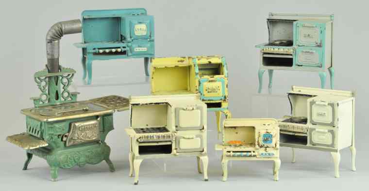 Appraisal: GROUPING OF MINIATURE GAS RANGES Toy ranges done in cast