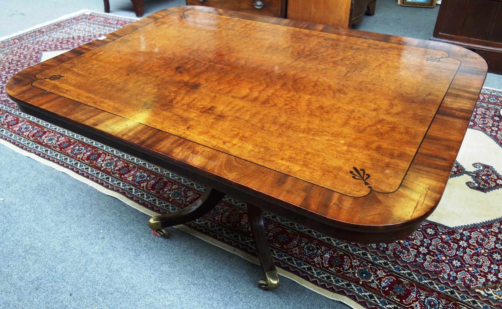 Appraisal: A George III breakfast table the inlaid rectangular snap top