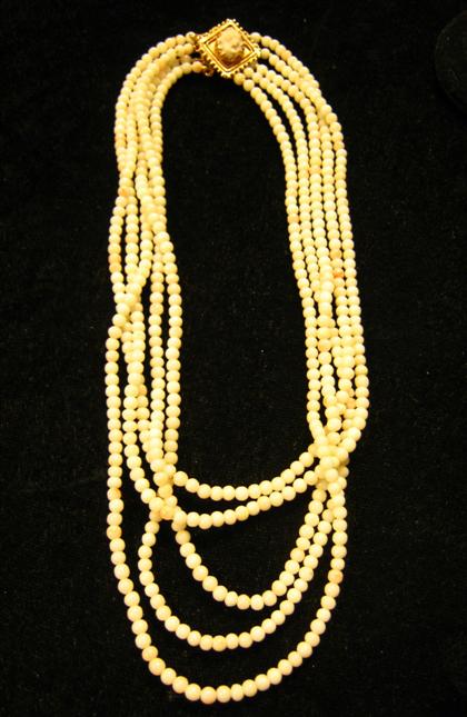 Appraisal: Angel skin coral bead necklaceFour strands gold clasp accented by