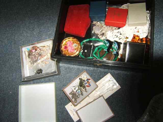 Appraisal: A BLACK JEWELLERY BOX containing a quantity of paste jewellery