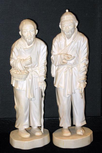 Appraisal: Pair of Carved Ivory Figures Well-carved pair of joyous elderly