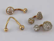 Appraisal: A mixed lot comprising four items of piercing jewellery three