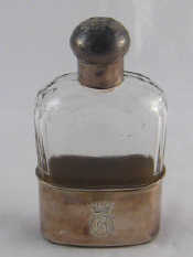 Appraisal: A Victorian silver mounted faceted glass hip flask and cup