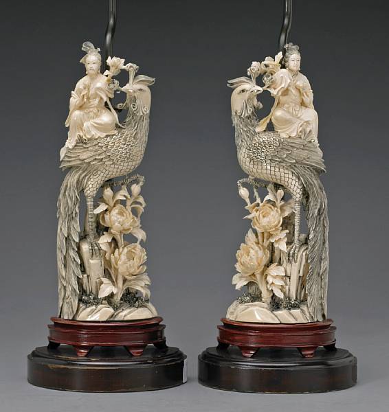 Appraisal: A pair of tinted ivory tusk sections th Century Each