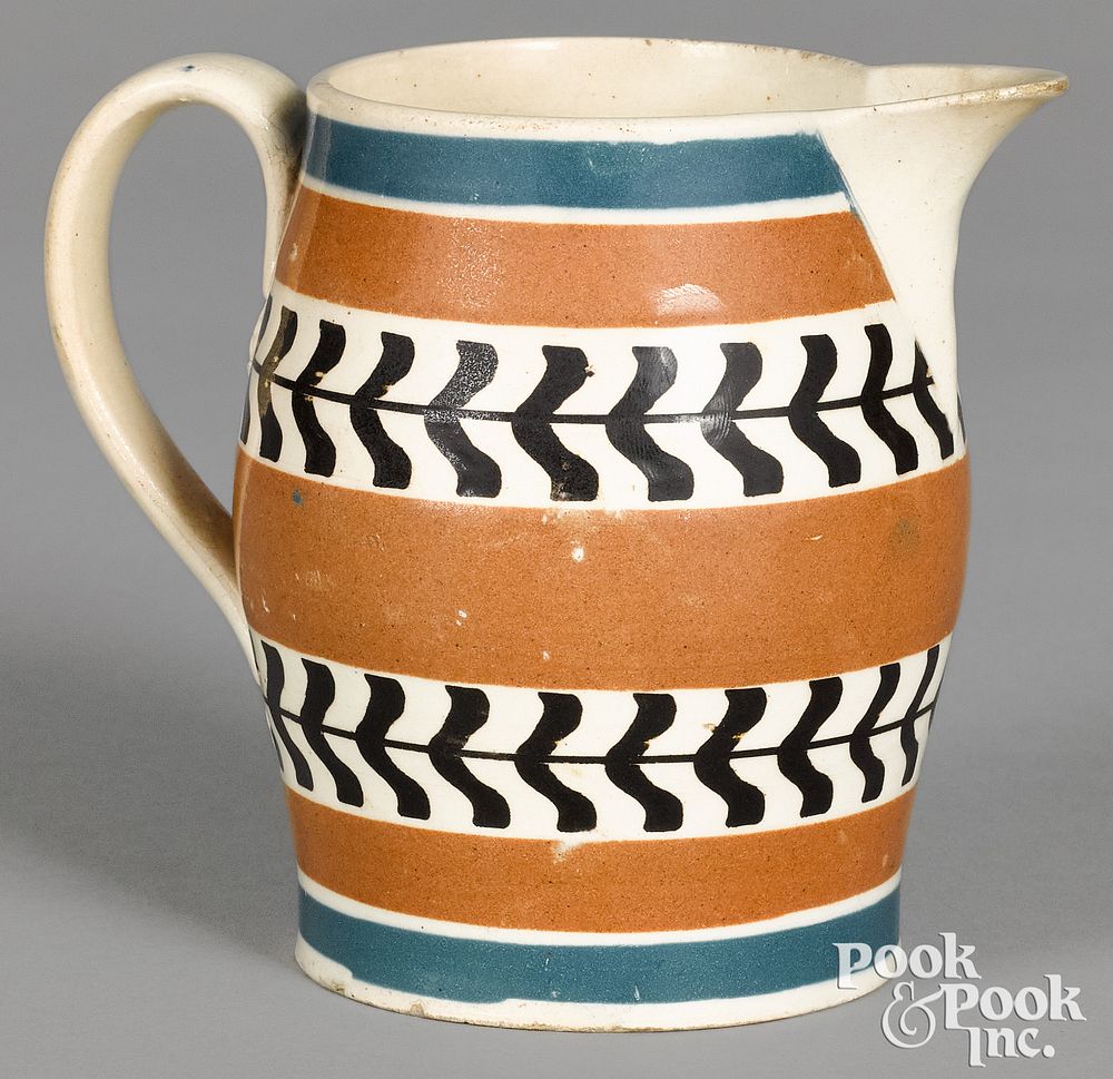 Appraisal: Mocha creamer with blue and brown bands Mocha creamer with