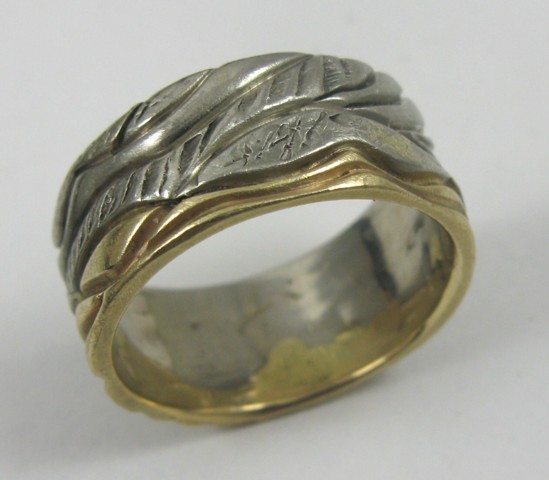 Appraisal: MAN'S YELLOW AND WHITE GOLD RING The band is k