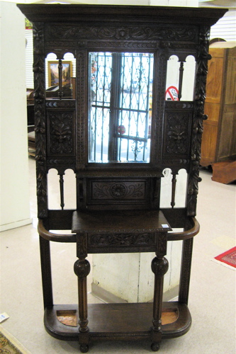 Appraisal: HIGHLY CARVED OAK HALLSTAND English th century having a console