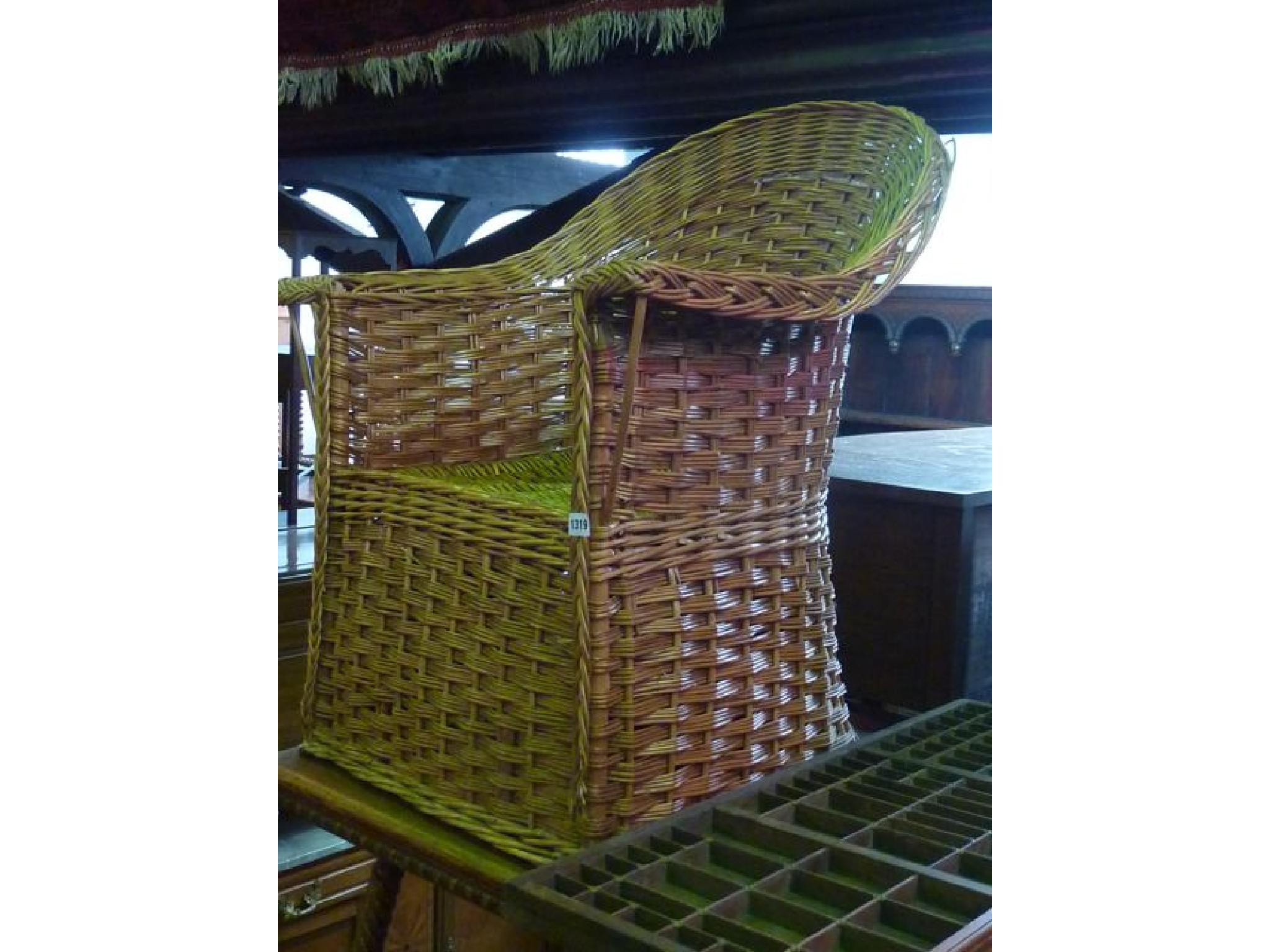 Appraisal: A wicker tub chair with shaped outline together with a