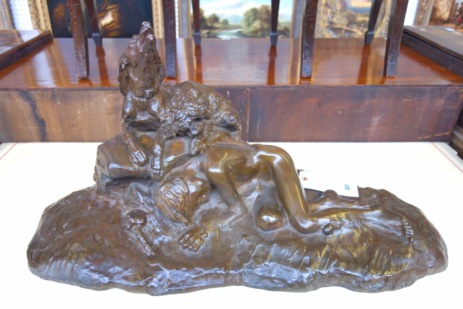 Appraisal: A French bronze group of a sleeping boy with two