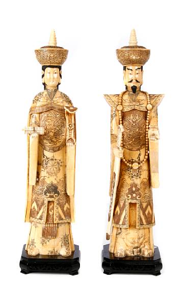 Appraisal: A pair of Chinese carved and enameled bone veneer Emperor