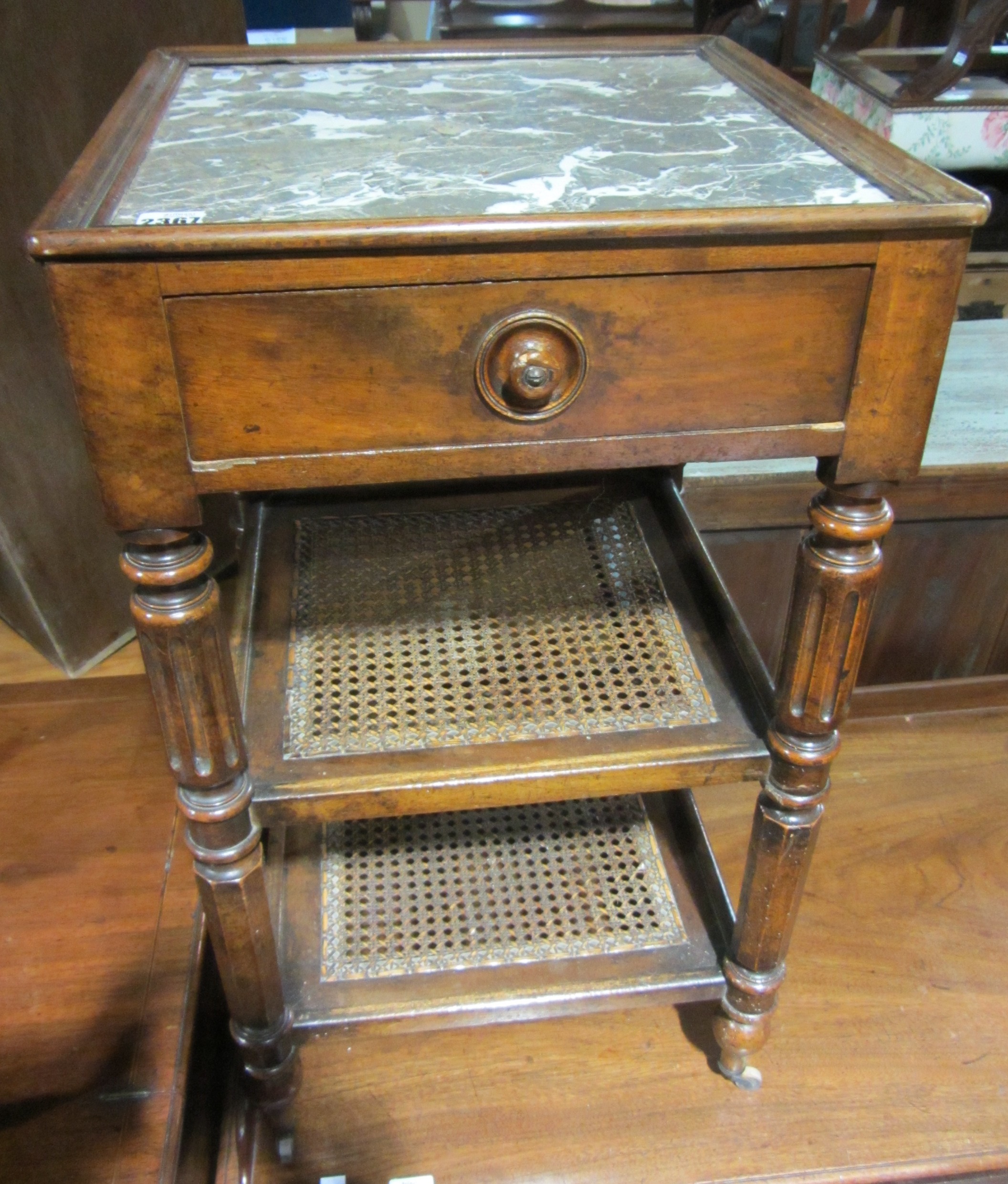 Appraisal: A th century walnut three tier bedside table with inset