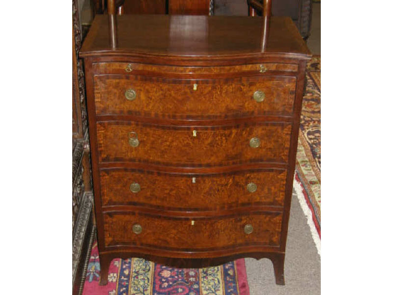 Appraisal: PAIR OF GEORGIAN STYLE BACHELOR'S CHESTS Of mahogany and walnut