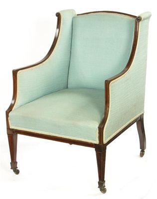 Appraisal: An Edwardian mahogany easy armchair with stringing and ceramic castors