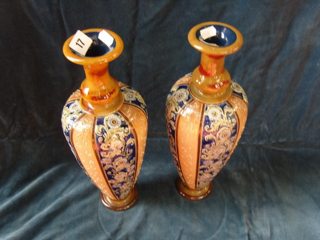 Appraisal: A pair of Doulton Lambeth stoneware vases of slender ovoid