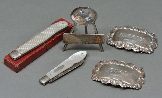 Appraisal: A PAIR OF SILVER DECANTER LABELS square shaped with scroll