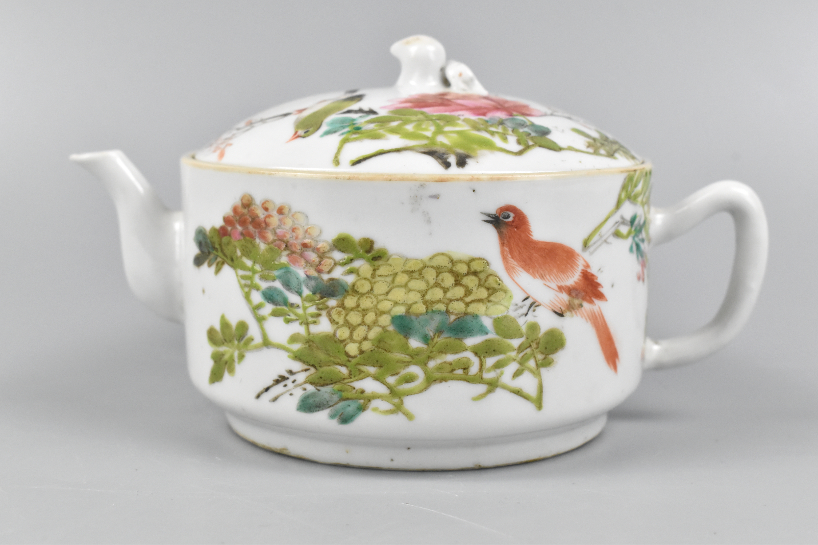 Appraisal: A Chinese Qianjiang glazed teapot with birds and flowers Delicate