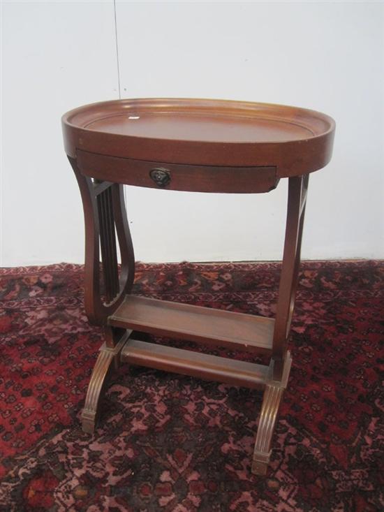 Appraisal: OVAL STAND A th C Regency style mahogany oval one