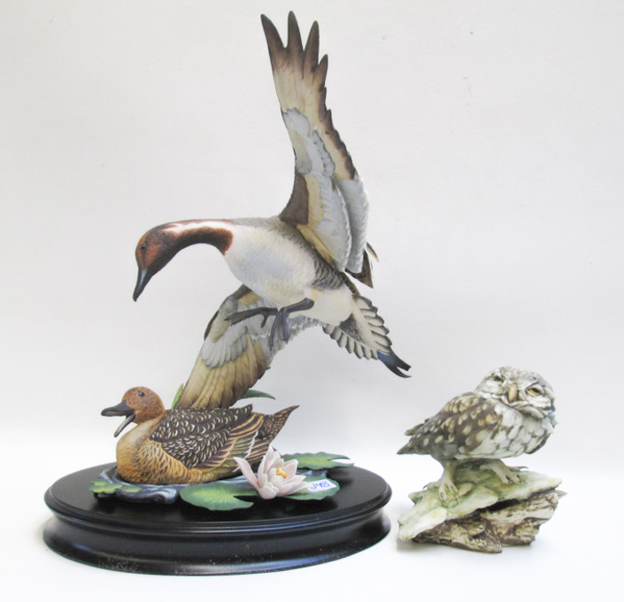 Appraisal: TWO BISQUE PORCELAIN BIRD FIGURES the first of a male