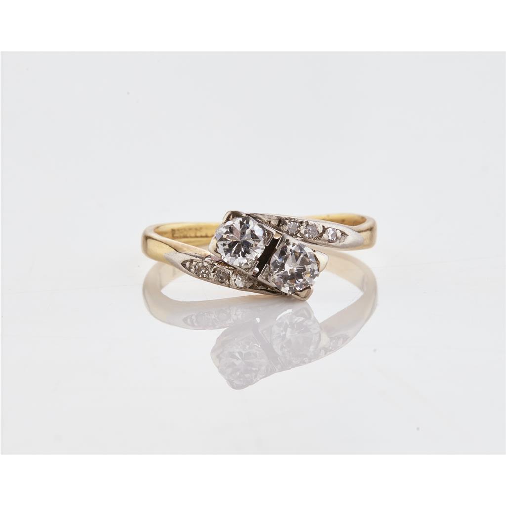 Appraisal: A two stone diamond ring claw set with two round