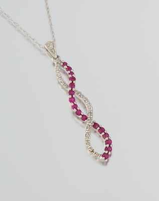 Appraisal: A Ladies' Diamond and Ruby Pendant k white gold pendant